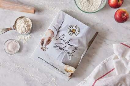 Baking School cookbook on a baking work surface