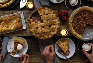 Pies and pear tart on a Thanksgiving table
